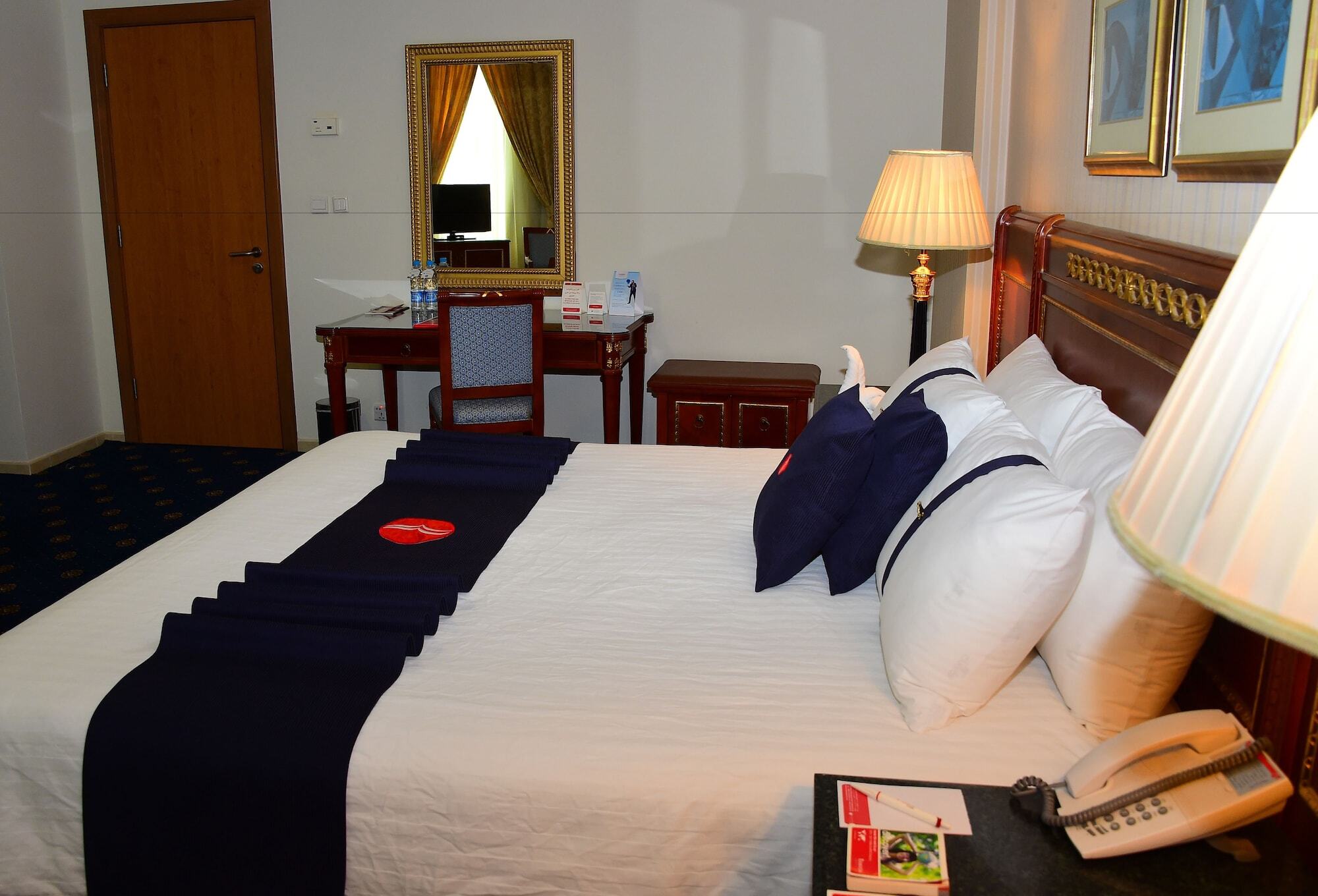 Ramada Hotel & Suites By Wyndham Al Qassim Al Bukayriah Εξωτερικό φωτογραφία A bedroom at the hotel
